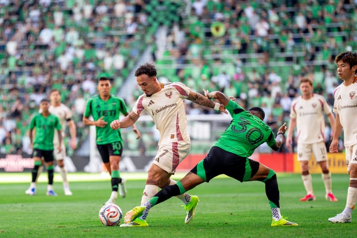 A photo of D.C. United's João Peglow dribbling away from Austin FC's Joseph Rosales during the March 1, 2026 MLS match between the sides.