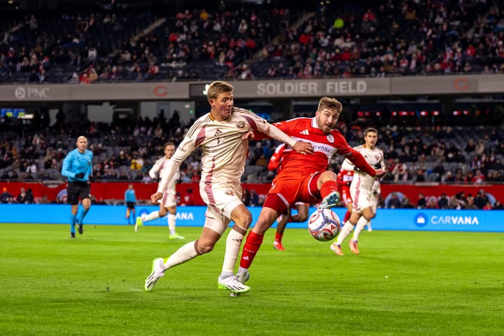 D.C. United's Jackson Hopkins and Johnny Dean of the Chicago Fire battle for a loose ball at Soldier Field on March 14, 2026.
