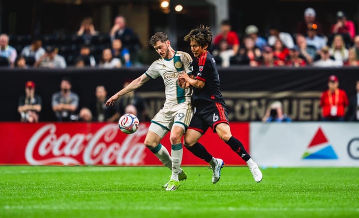 Keisuke Kurokawa and Alexey Miranchuk battle for the ball during D.C. United's MLS game at Atlanta United.